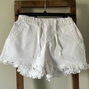 White denim fringe shorts with elastic drawstring waist